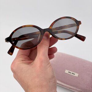 Miu Miu REGARD Women’s Oval Sunglasses – Havana Grey Model MU04ZS 21C40O